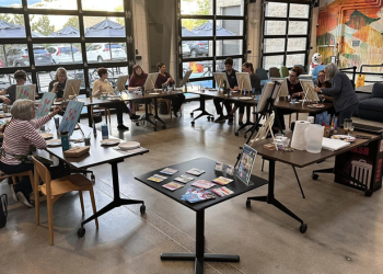 Toast n Tinker participants painting together at the Superior Community Center