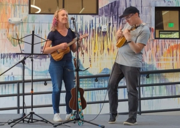 Two residents perform with ukuleles at Superior Community Center's Open Mic Night