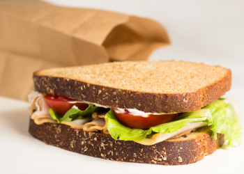 Brown bag with a tasty sandwich