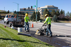 Public works fixing potholes on Rock Creek Parkway