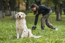 Person pickup after a dog to keep it out of recrational areas