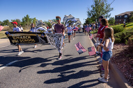 Monarch high school band marching in the 4th of July celebration.