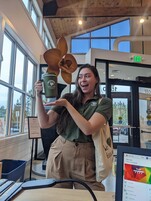 Sydney celebrates finding a long lost mug in the lost and found bin at the Superior Community Center