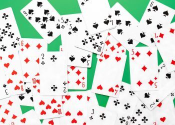 Cards sit on a green backdrop