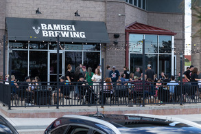 People on the patio outside Bambei Brewing