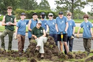 Boulder County Youth Corps members posing for the camera while working outside