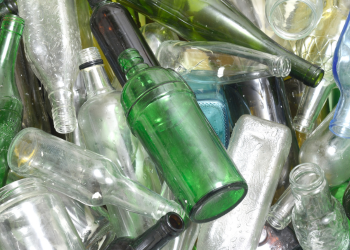 Bin of assorted glass bottles