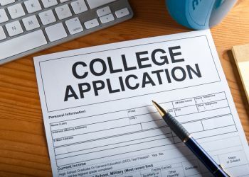 College application with a pen on a desk