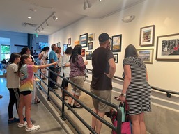 People viewing the superior snaps exhibition 