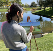 Person painting during the Plein Air Painting festival 