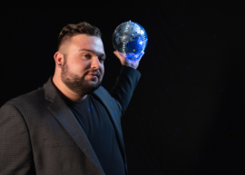 Singer Jacob Larson holding a disco ball