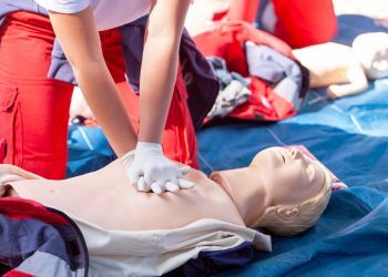 Person gives a dummy CPR during a CPR training
