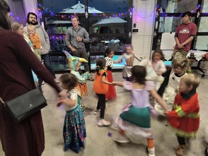 Children dancing in costume during the Moster Mash