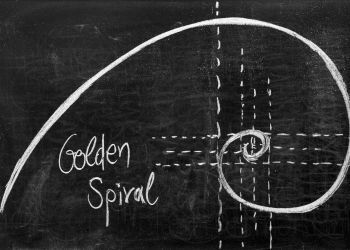 The Fibonacci spiral drawn in chalk on a chalkboard. 