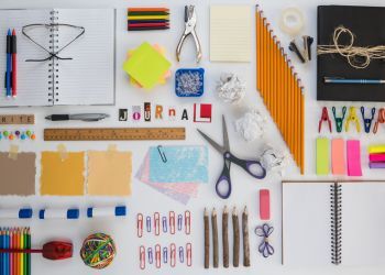 Art supplies with magazine letters cut out reading "journal"