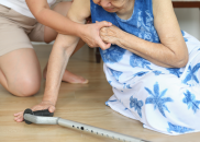 Person assisting another person who has fallen