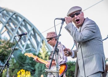 Members of the Delta Sonics perform on stage