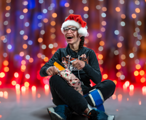 A Precious Child Gift Drive boy opening a gift