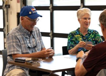 A Superior resident plays euchre at the Superior Community Center
