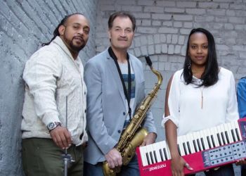 Members of the Dotsero Trio pose for a photo with their instruments.