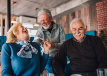 Three seniors laughing