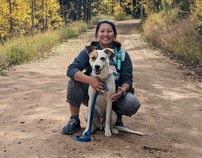 Phary Om posing on a trail with dog Summit