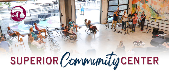 Superior Community Center banner with people enjoying a concert at the center
