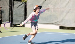 tennis youth reaching for a ball