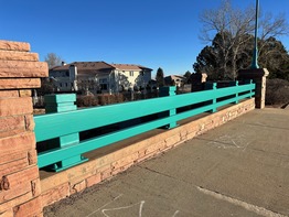 Newly painted teal rails over coal creek.