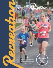 Front cover of summer 2024 Recreation Guide ( Adult and youth participants in the 4th of July Downhill Mile)