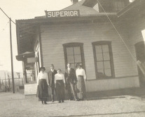 Black and white photograph of residents at the Superior train station in the early 1900's.