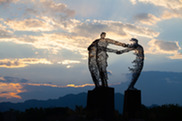 McCaslin roundabout statue at dusk taken by Andrew Triptych