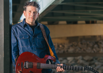 Josh Blackburn posing with his guitar