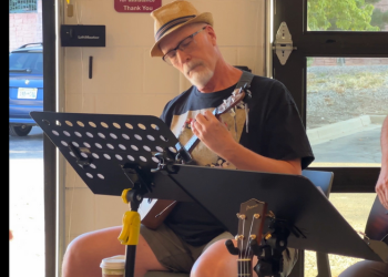 Man plays a ukulele at the Superior Community Center