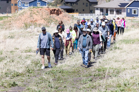 A long line of people heading to the Historic Mining site through the Boulder County Open Space.