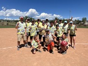 Kickball team posing before their game at the 2022 4th of July Celebration