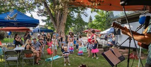 Neighbors gathering together to listen to live music