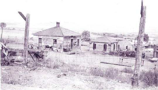 Typical mine camp scene probably near the end of mine production due to lack of upkeep on the houses.