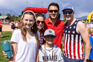 Community members posing at the 4th of July pancake festival.