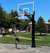 young person playing basketball 