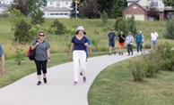 People walking around Wildflower Park during Walk with a Doc.