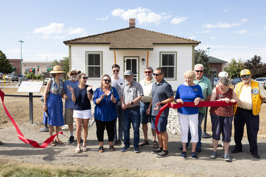 Historical Commision Chair Larry Dorsey cutting the ribbon on the brand new Historical Musuem replica.
