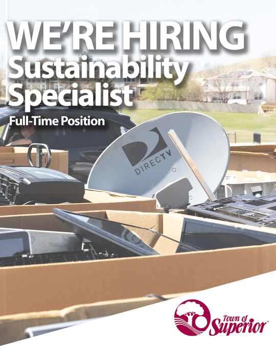 People holding up pretzels in their vendor booths during the 2023 Chili and Beer Fest.