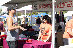 Volunteer manning the information tent.