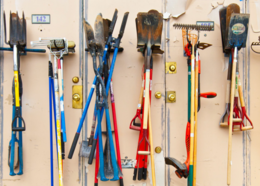 A variety of hand tools hang on a wall at Resource Central