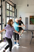Two seniors and an instructor participating in Bingocize
