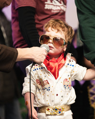Photo of a child in an Elvis Halloween costume