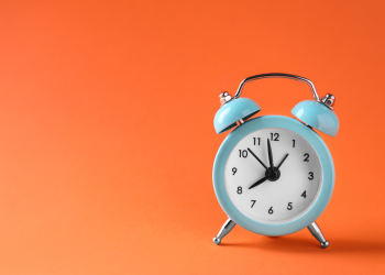 Blue clock on orange background