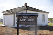 Rebuilt Historical Museum with historic Town of Superior sign