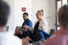 Trustees speaking during First Fridays Coffee.